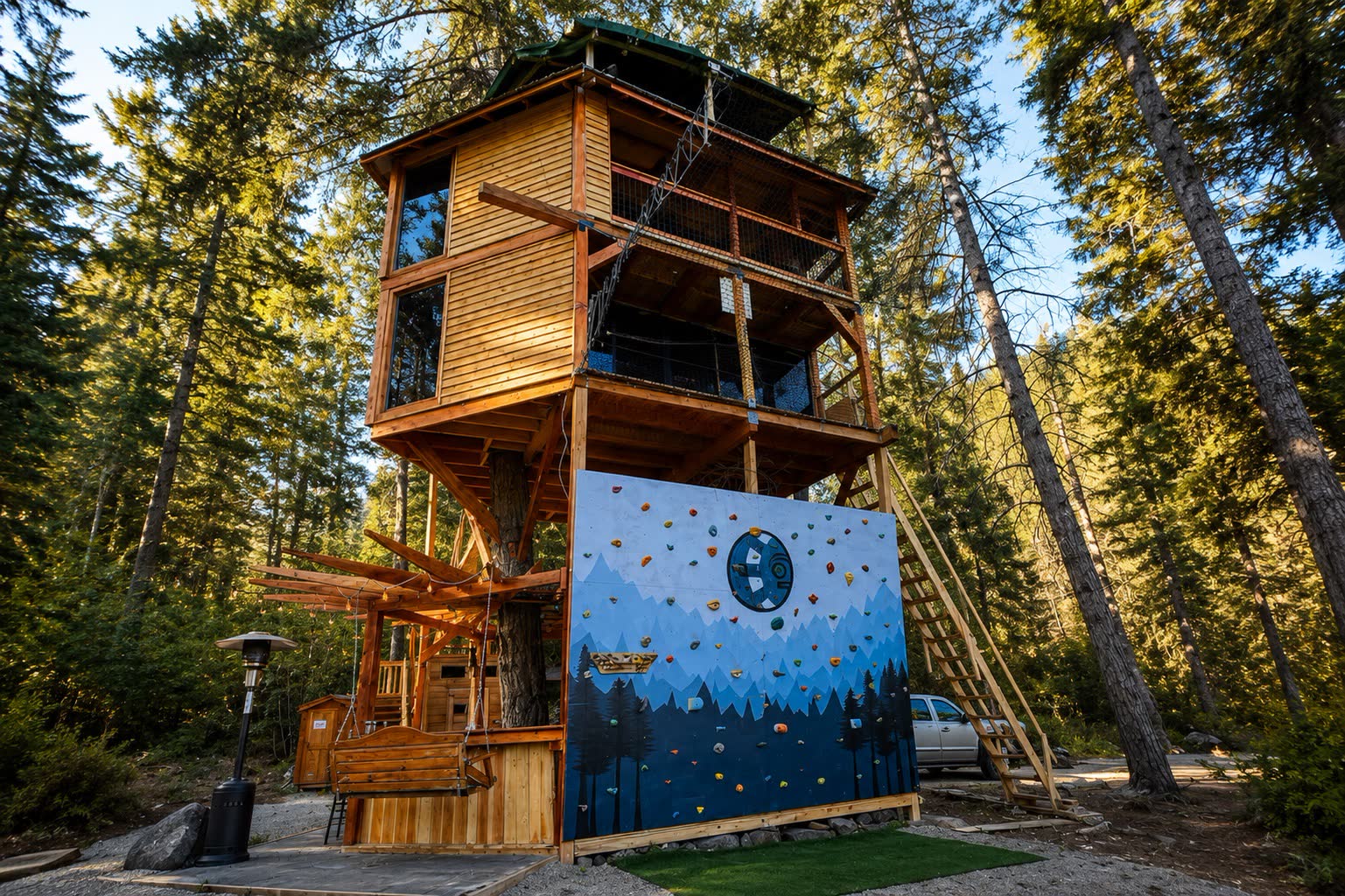 Treehouse climbing wall and saucer swing